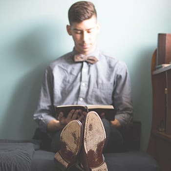reading strategies feature image of a man reading a book