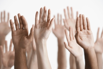 Image of hands raising to illustrate a point about focus and concentration