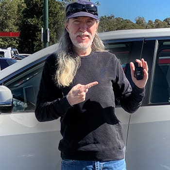 Deskilling feature image of Anthony Metivier with car keys after relearning how to drive after ten years