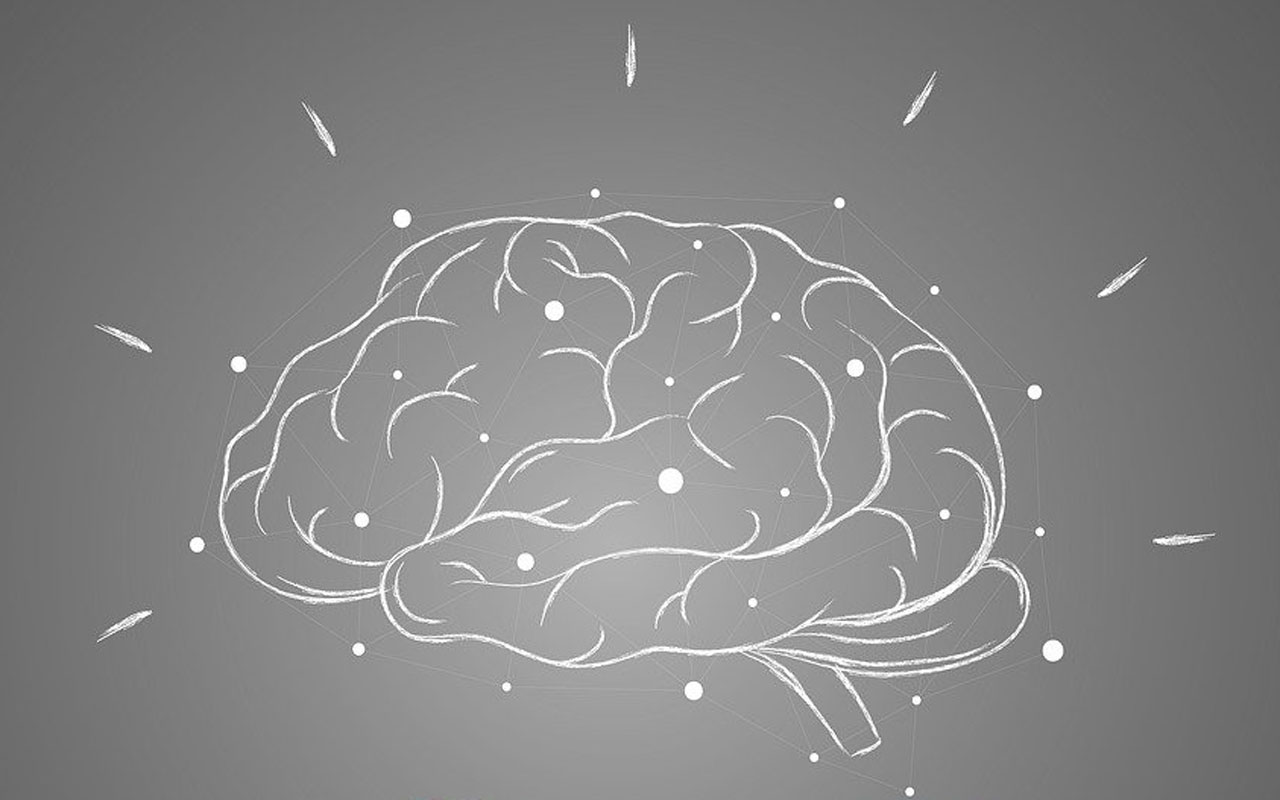 A chalk drawing of a human brain. Dementia and other memory disorders negatively affect the brain.