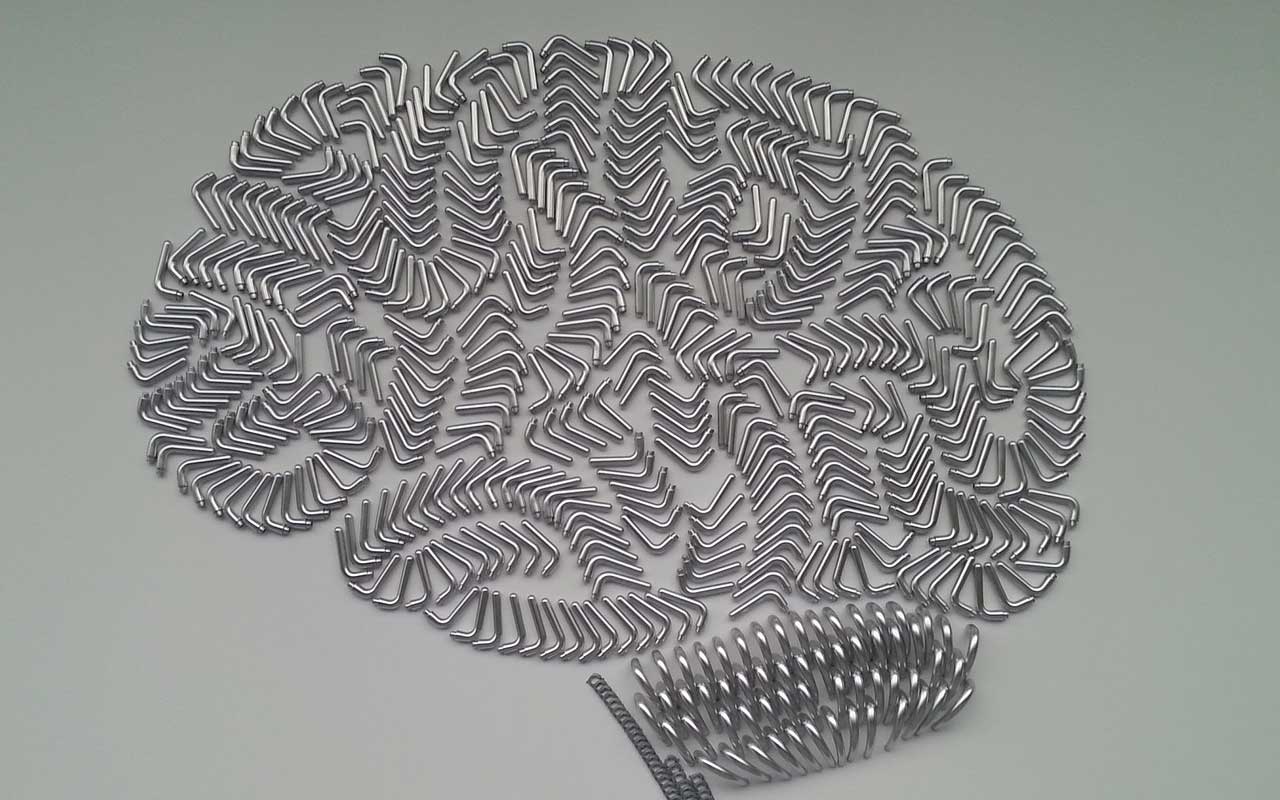 An artistic image of a brain made with metal pieces. Vascular cognitive impairment and other memory disorders can negatively affect brain function.