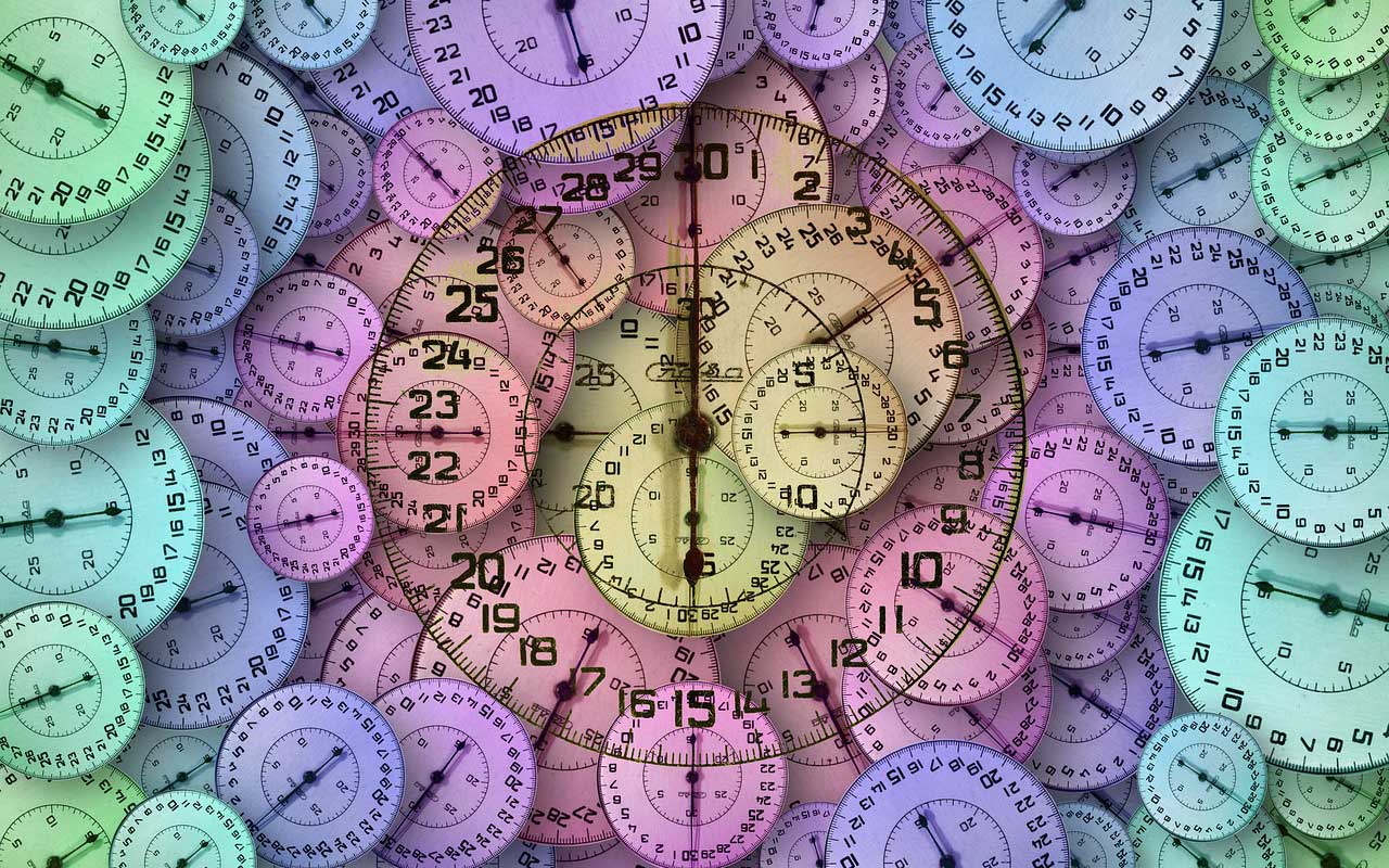 A mosaic of clocks in different colors, representing the daily rituals you might choose to help you concentrate on work.