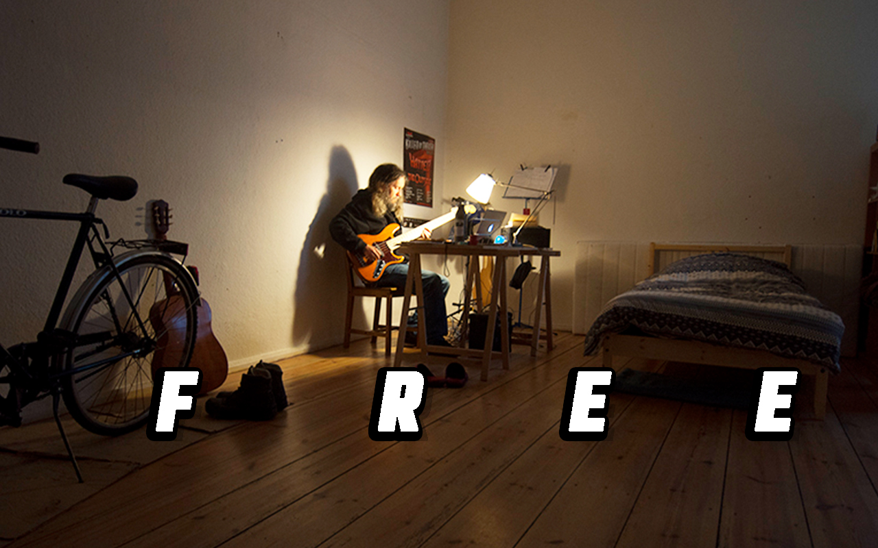 A photo of Anthony with a guitar at his desk, including his F.R.E.E. mnemonic device.