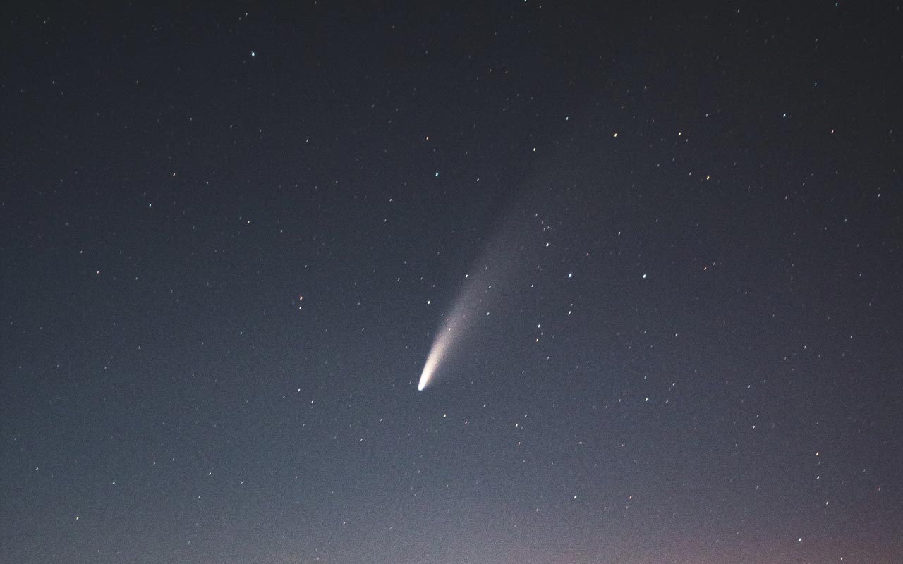 A comet streaks across a darkened sky. Using Halley's comet to remember the name Haley is a way to help you remember names.