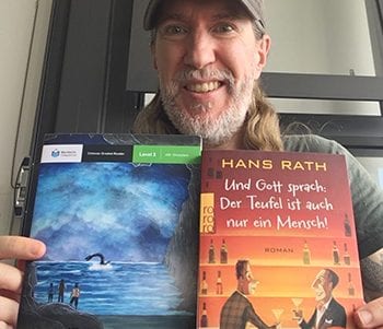 Anthony Metivier reading books in Chinese and German