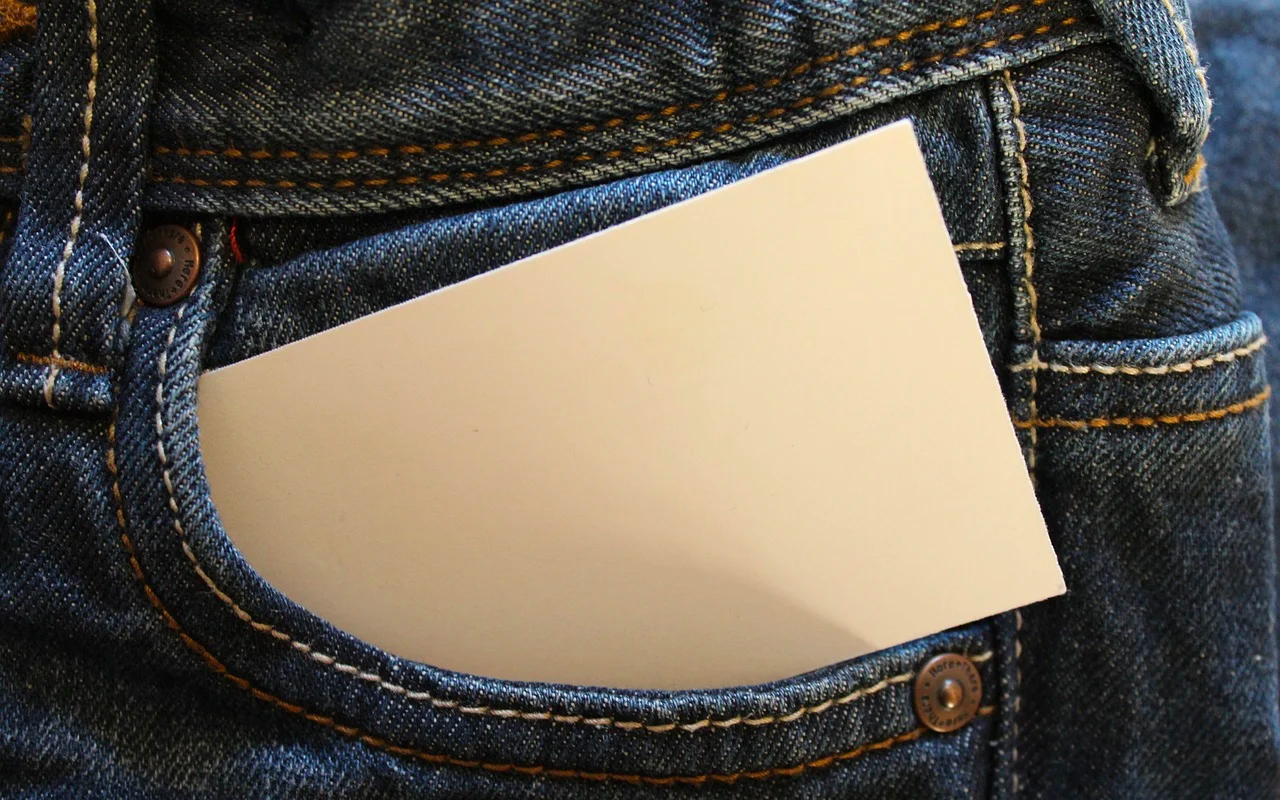 jeans with a piece of paper for writing a list in the pocket