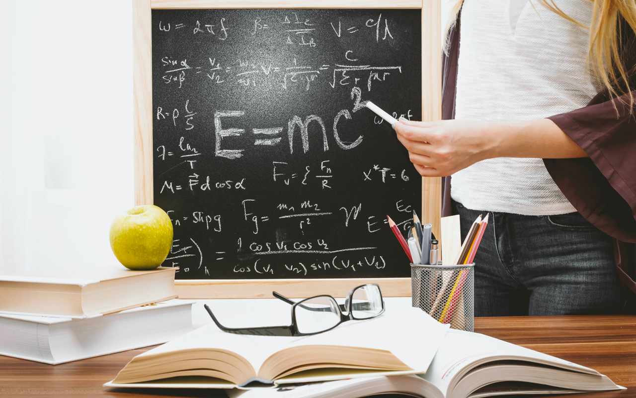 man at chalkboard