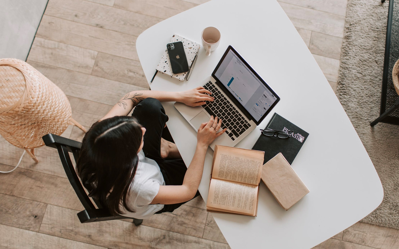 a woman is studying at home
