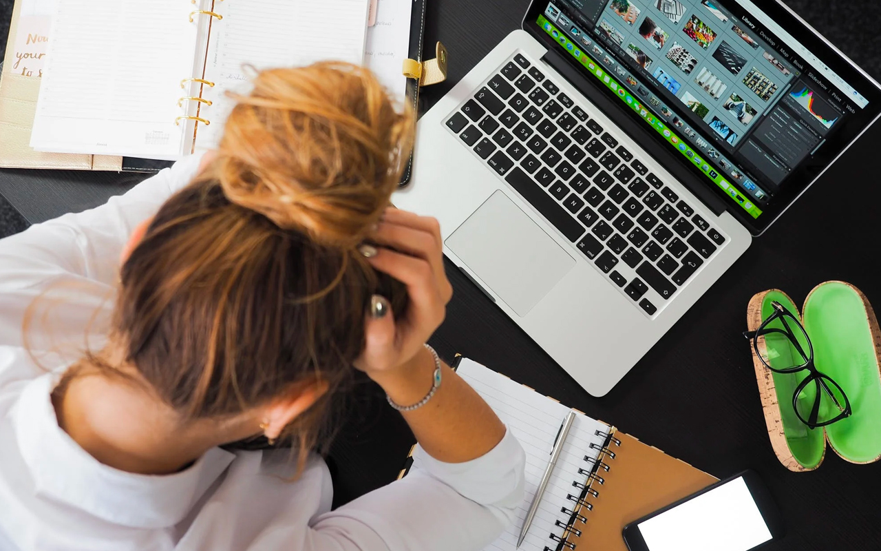 a woman is struggling with her work
