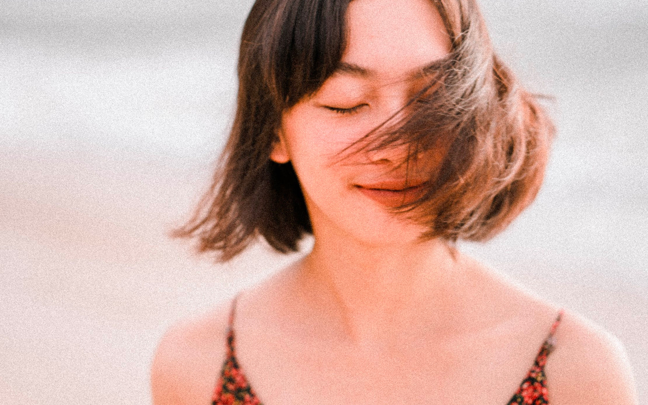 a women is thinking with her eyes closed