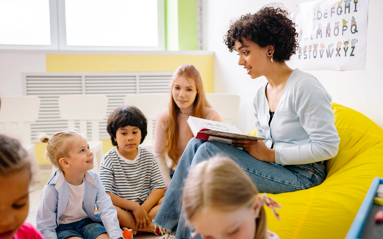 a teacher teaching kids to read