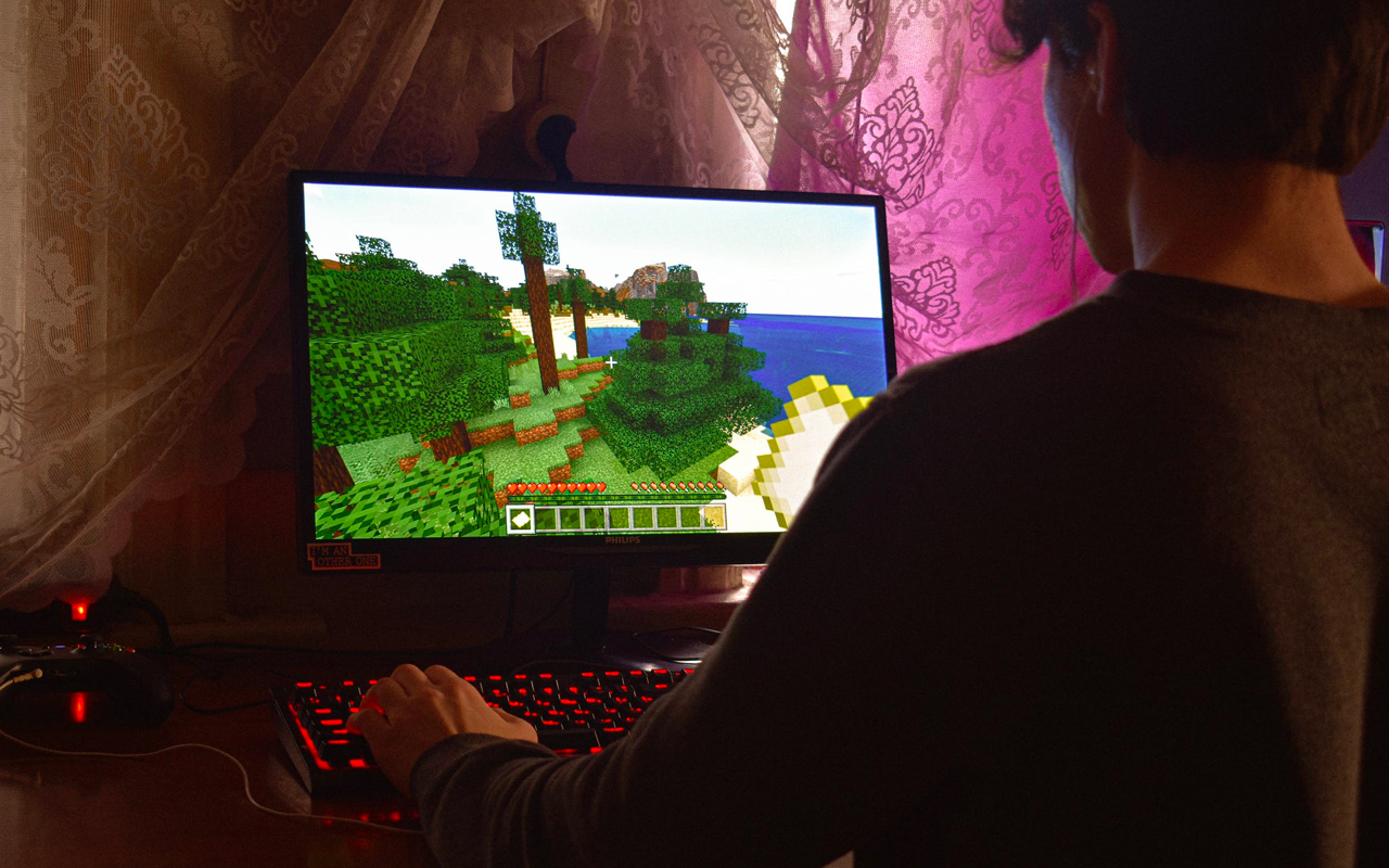 a young boy is playing video games
