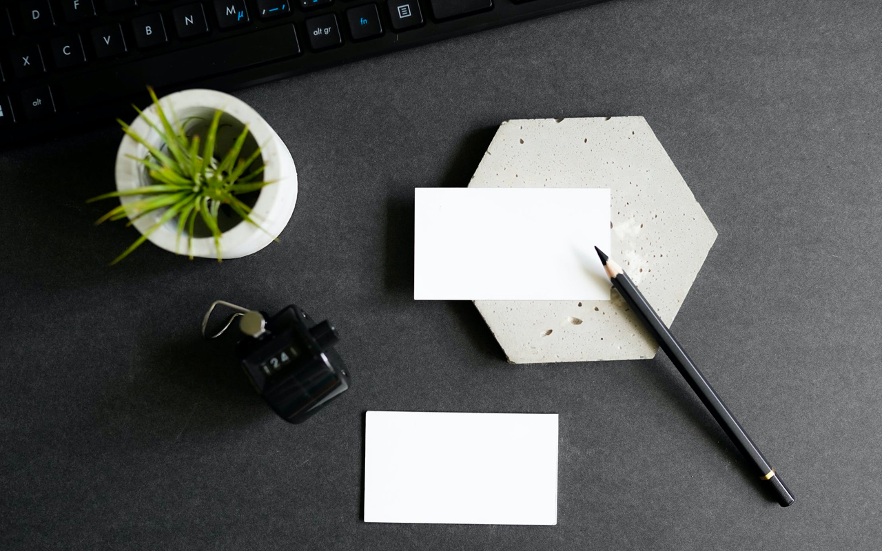 a black pen and white cards