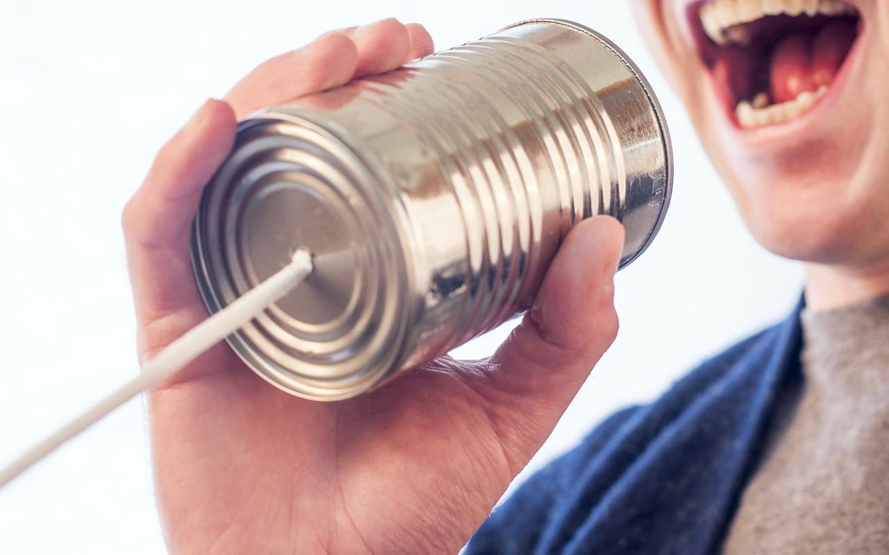 speaking with a can