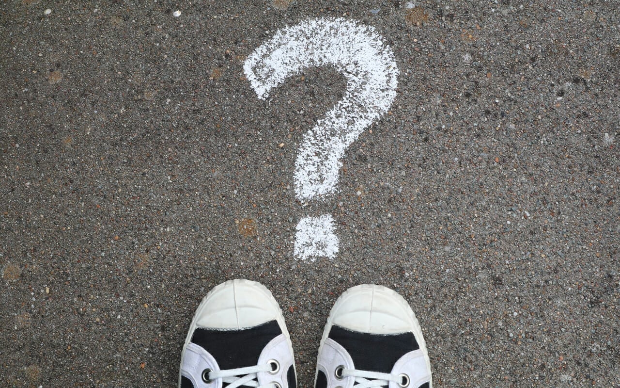 a question mark on the ground