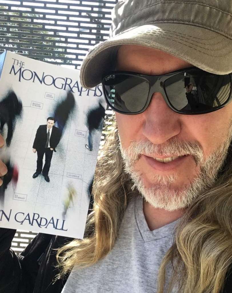 Anthony Metivier with a copy of The Monographs by Ben Cardall