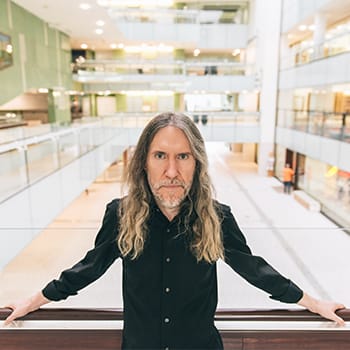 how to keep your memory sharp as you age feature image of Anthony Metivier in State Library of Queensland