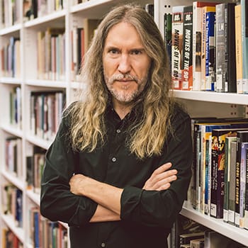 Anthony Metivier with books for this memory coaching feature image