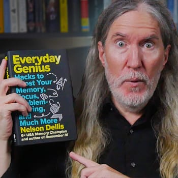 Anthony Metivier holding a copy of Everyday Genius by Nelson Dellis